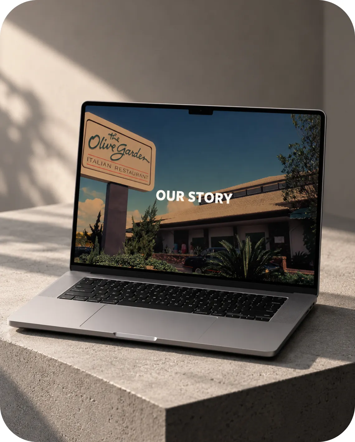 The Olive Garden India website on a laptop